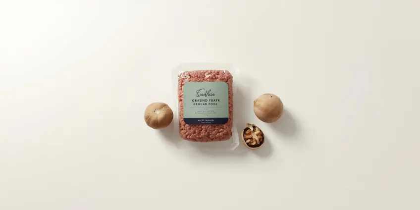 A side-by-side illustration comparing ground pork to a plant-based alternative of mushrooms and walnuts.