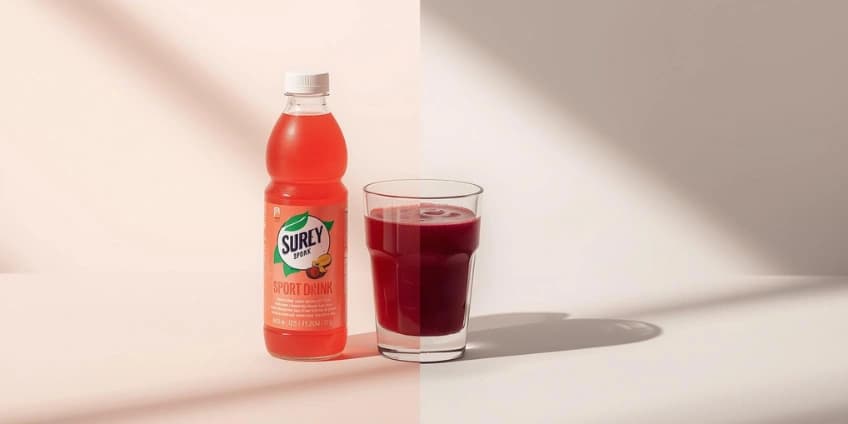 A side-by-side illustration swapping a sugary sports drink for a glass of natural beetroot juice.